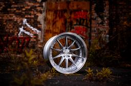JR Wheels JR41 Silver alloy wheel mounted on car in an atmospheric setting