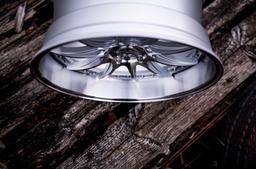 JR Wheels JR41 Silver alloy wheel mounted on car in an atmospheric setting