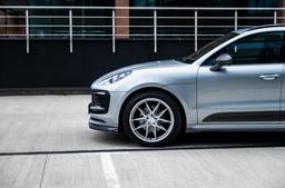 JR Wheels JR44 Silver alloy wheel mounted on car in an atmospheric setting