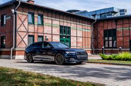 JR Wheels JR45 Bronze alloy wheel mounted on car in an atmospheric setting