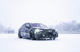 JR Wheels JR45 Black alloy wheel mounted on car in an atmospheric setting