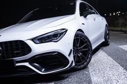 JR Wheels JR45 Grey alloy wheel mounted on car in an atmospheric setting