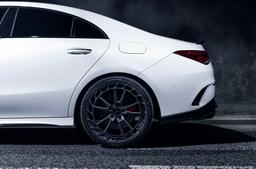 JR Wheels JR45 Grey alloy wheel mounted on car in an atmospheric setting