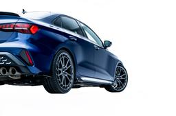 JR Wheels JR45 Grey alloy wheel mounted on car in an atmospheric setting