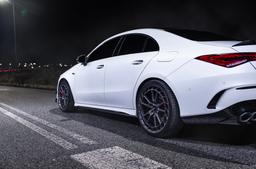 JR Wheels JR45 Grey alloy wheel mounted on car in an atmospheric setting