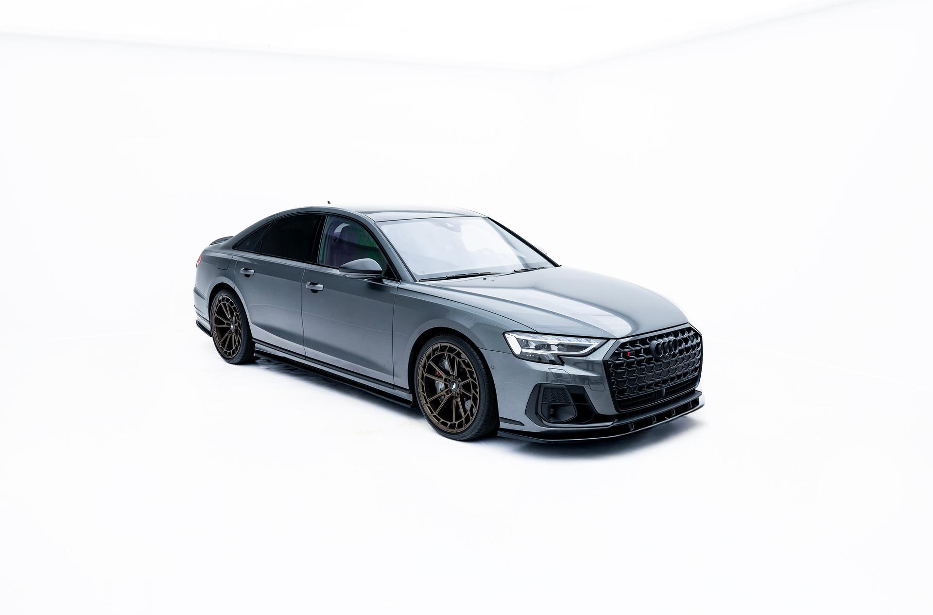 JR Wheels JR45 Bronze alloy wheel mounted on car in an atmospheric setting