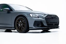 JR Wheels JR45 Bronze alloy wheel mounted on car in an atmospheric setting