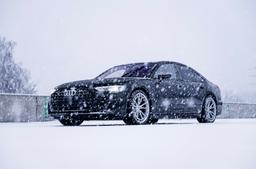 JR Wheels JR45 Silver alloy wheel mounted on car in an atmospheric setting