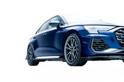 JR Wheels JR45 Grey alloy wheel mounted on car in an atmospheric setting