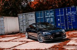 JR Wheels JR46 Silver alloy wheel mounted on car in an atmospheric setting
