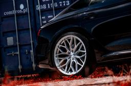 JR Wheels JR46 Silver alloy wheel mounted on car in an atmospheric setting