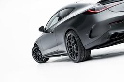 JR Wheels JR46 Grey alloy wheel mounted on car in an atmospheric setting