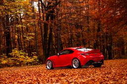 JR Wheels JR47 Silver alloy wheel mounted on car in an atmospheric setting