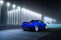 JR Wheels JR47 Silver alloy wheel mounted on car in an atmospheric setting