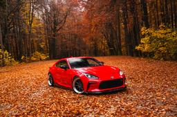 JR Wheels JR47 Grey alloy wheel mounted on car in an atmospheric setting