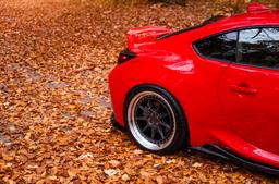 JR Wheels JR47 Grey alloy wheel mounted on car in an atmospheric setting