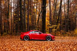 JR Wheels JR47 Grey alloy wheel mounted on car in an atmospheric setting