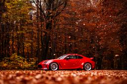 JR Wheels JR47 Silver alloy wheel mounted on car in an atmospheric setting