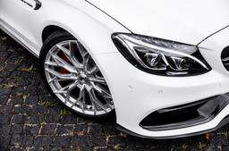 JR Wheels JR49 Silver alloy wheel mounted on car in an atmospheric setting