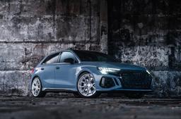 JR Wheels JR50 Silver alloy wheel mounted on car in an atmospheric setting