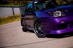 JR Wheels JR5 Grey alloy wheel mounted on car in an atmospheric setting