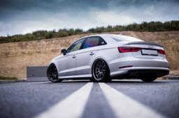 JR Wheels JR5 Grey alloy wheel mounted on car in an atmospheric setting