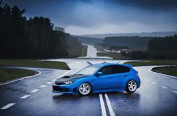 JR Wheels JR6 Silver alloy wheel mounted on car in an atmospheric setting