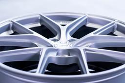 JR Wheels SL-01 Silver alloy wheel mounted on car in an atmospheric setting