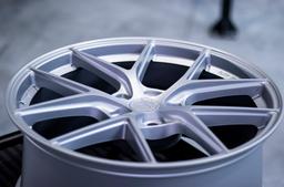 JR Wheels SL-01 Silver alloy wheel mounted on car in an atmospheric setting