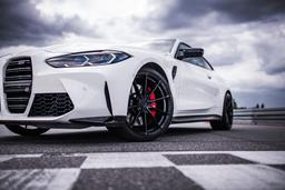 JR Wheels SL-02 Black alloy wheel mounted on car in an atmospheric setting