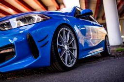 JR Wheels SL-02 Silver alloy wheel mounted on car in an atmospheric setting