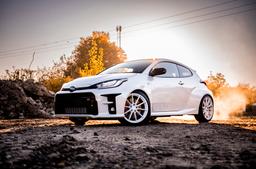 JR Wheels SL-02 White alloy wheel mounted on car in an atmospheric setting