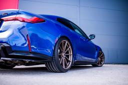 JR Wheels SL-02 Bronze alloy wheel mounted on car in an atmospheric setting