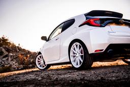 JR Wheels SL-02 White alloy wheel mounted on car in an atmospheric setting