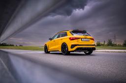 JR Wheels SL-02 Black alloy wheel mounted on car in an atmospheric setting