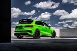 JR Wheels SL-03 Black alloy wheel mounted on car in an atmospheric setting