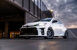 JR Wheels SL-04 Grey alloy wheel mounted on car in an atmospheric setting