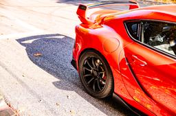 JR Wheels SL-04 Black alloy wheel mounted on car in an atmospheric setting