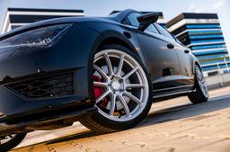 JR Wheels SL-04 Silver alloy wheel mounted on car in an atmospheric setting