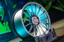 JR Wheels SL-05 Silver alloy wheel mounted on car in an atmospheric setting