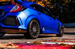 JR Wheels SL-05 Grey alloy wheel mounted on car in an atmospheric setting