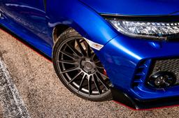 JR Wheels SL-05 Grey alloy wheel mounted on car in an atmospheric setting