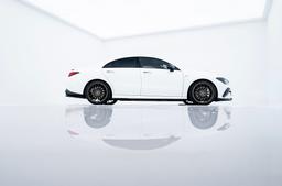 JR Wheels SL-05 Bronze alloy wheel mounted on car in an atmospheric setting