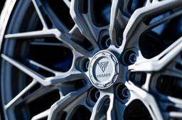 Vesser VSR1 Gloss Graphite alloy wheel mounted on car in an atmospheric setting