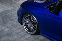 Vesser VSR4 Gloss Candy Violet alloy wheel mounted on car in an atmospheric setting