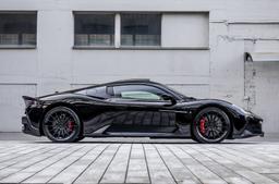 Vesser VSR4 Gloss Graphite alloy wheel mounted on car in an atmospheric setting