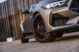 Vesser VSR6 Satin Candy Violet alloy wheel mounted on car in an atmospheric setting