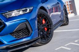 Vesser VSR6 Satin Candy Violet alloy wheel mounted on car in an atmospheric setting