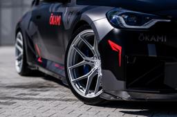 Vesser VSR7 Satin Bronze-Green Chameleon alloy wheel mounted on car in an atmospheric setting