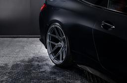 Vesser VSR7 Satin Bronze alloy wheel mounted on car in an atmospheric setting